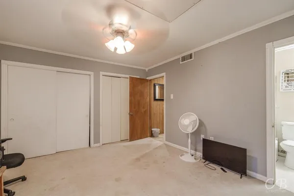 a room with furniture and lamp