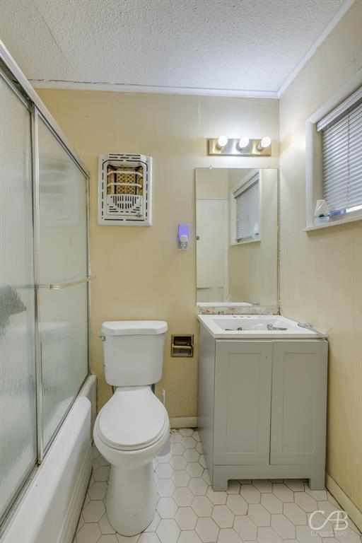 33 Northwest Ave A Hamlin, TX 79520 - Photo 29 of 37 a bathroom with a toilet sink and mirror
