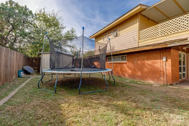 a backyard of a house with seating space