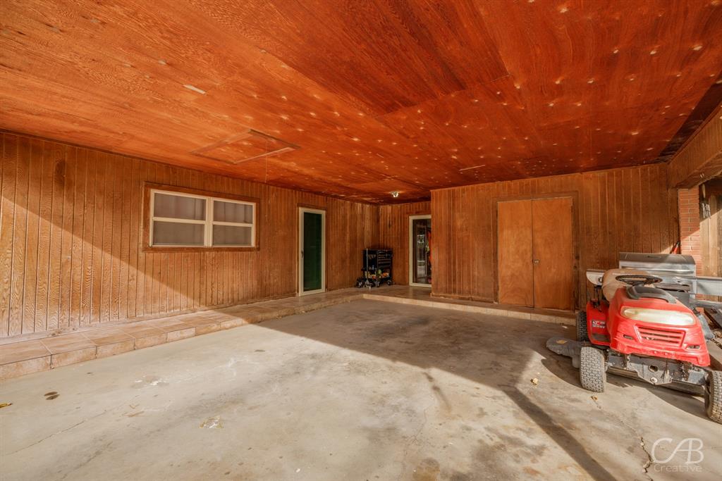 33 Northwest Ave A Hamlin, TX 79520 - Photo 36 of 37 a view of a house with outdoor space and a car parked in garage