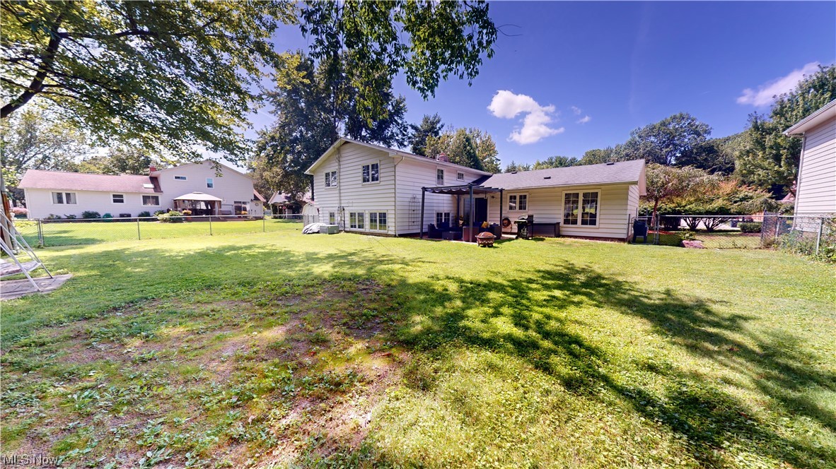 1071 Roland Road Lyndhurst, OH 44124 - Photo 25 of 30 Rear view of property with a lawn