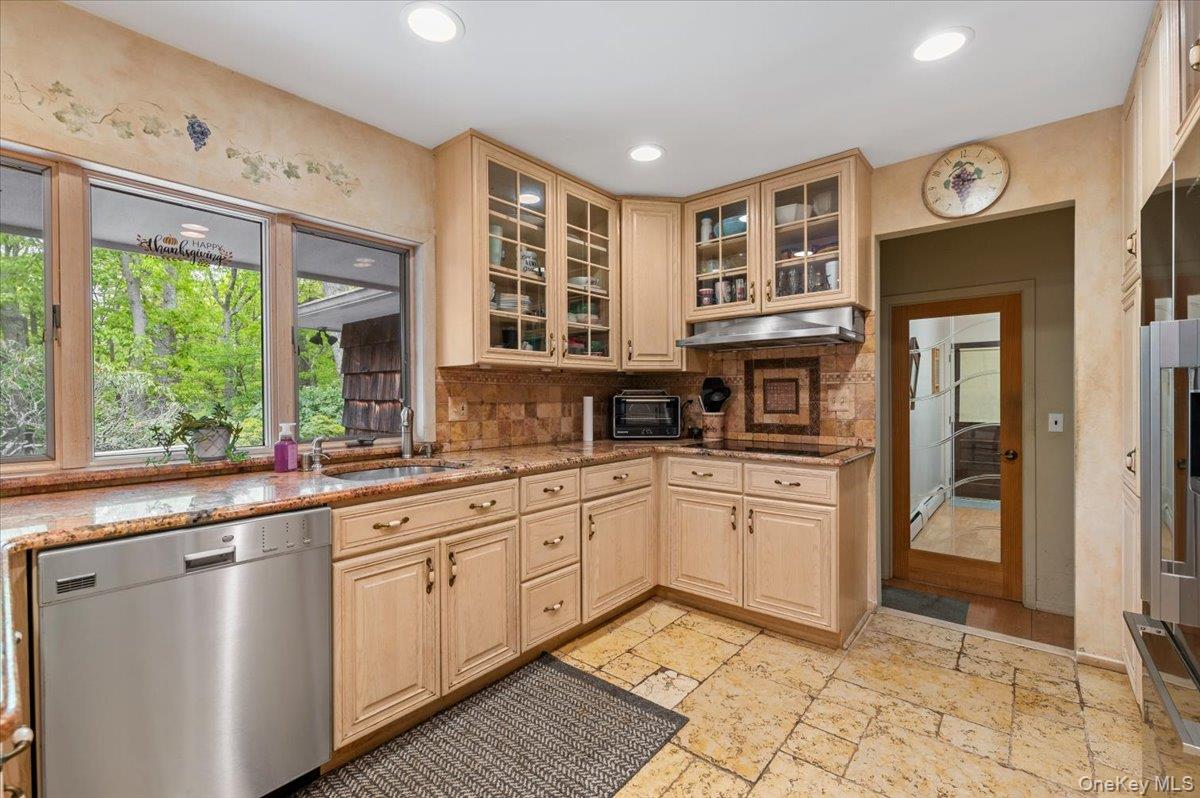 6 Apex Road Melville, NY 11747 - Photo 15 of 50 a kitchen with stainless steel appliances granite countertop a stove a sink and a refrigerator