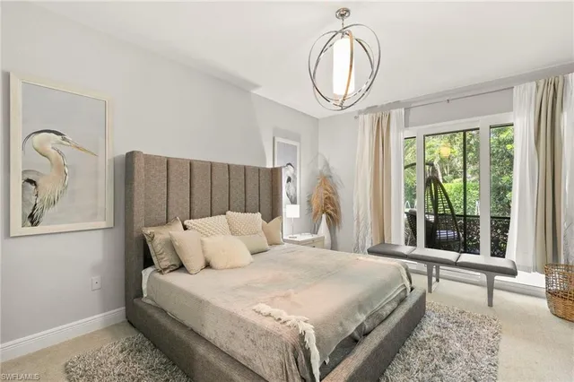 an aerial view of residential houses with outdoor space and ocean view