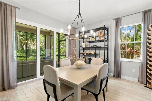a wooden bench sitting in front of a building