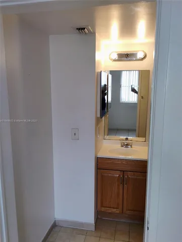 a kitchen with a stove and a refrigerator