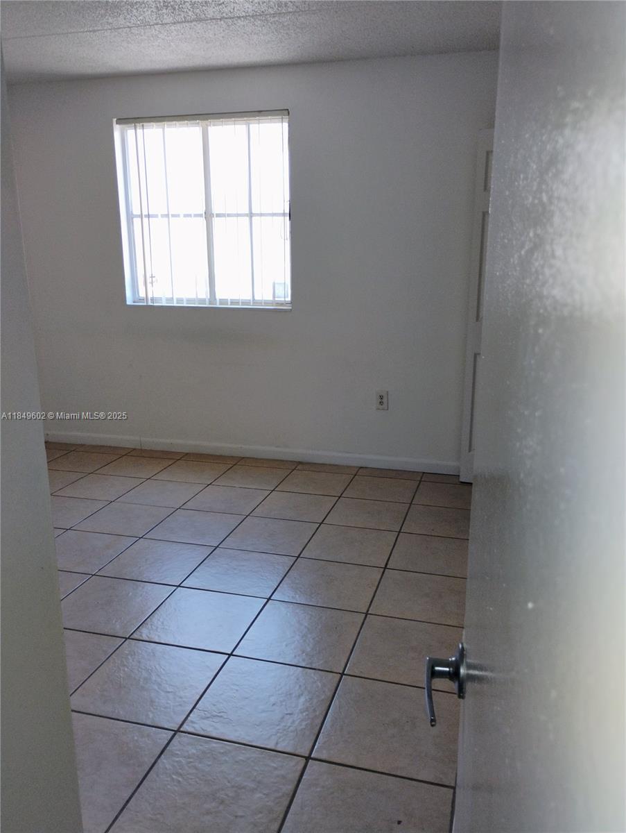 6045 Northwest 186th Street, Unit 304 Hialeah, FL 33015 - Photo 19 of 28