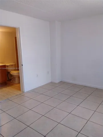 a front view of a building with a yard