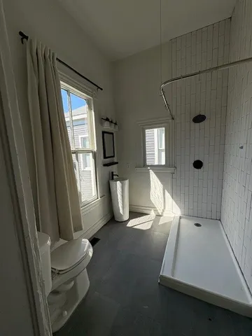 a room with window and a chair