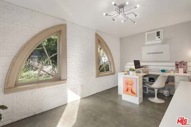 a living room with a window and a table