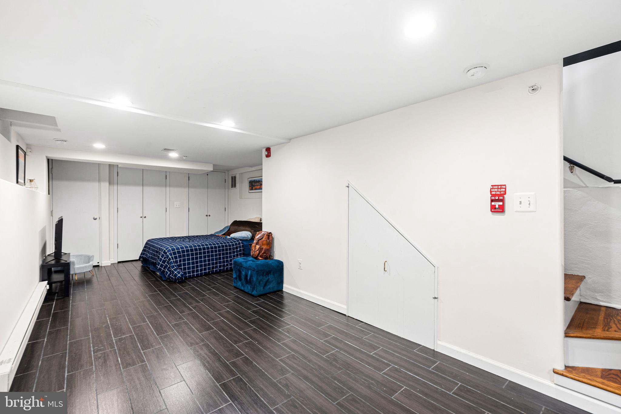 729 South 12th Street, Unit 101 Philadelphia, PA 19147 - Photo 13 of 25 a living room with furniture and wooden floor