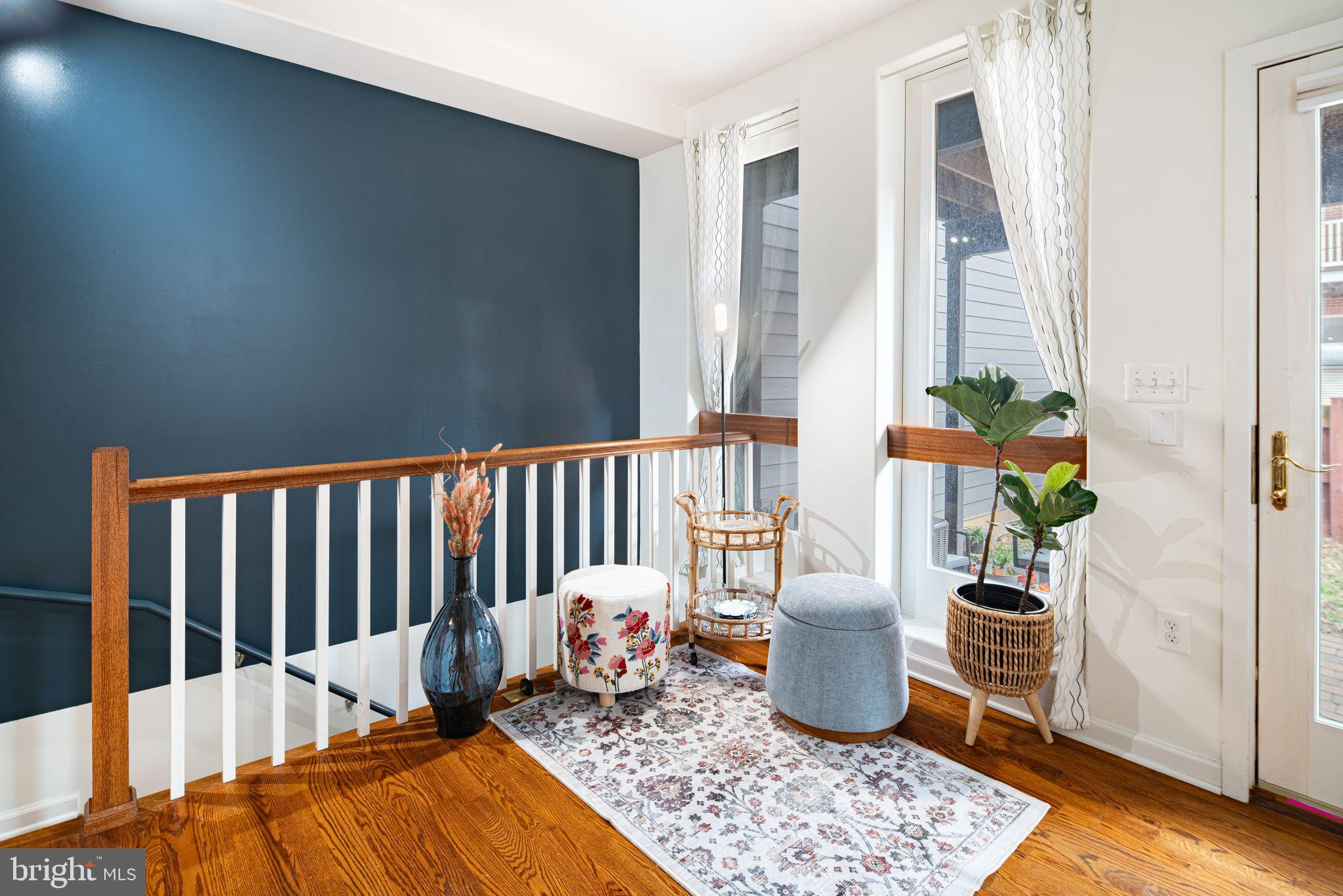 729 South 12th Street, Unit 101 Philadelphia, PA 19147 - Photo 2 of 25 a living room with furniture and a potted plant