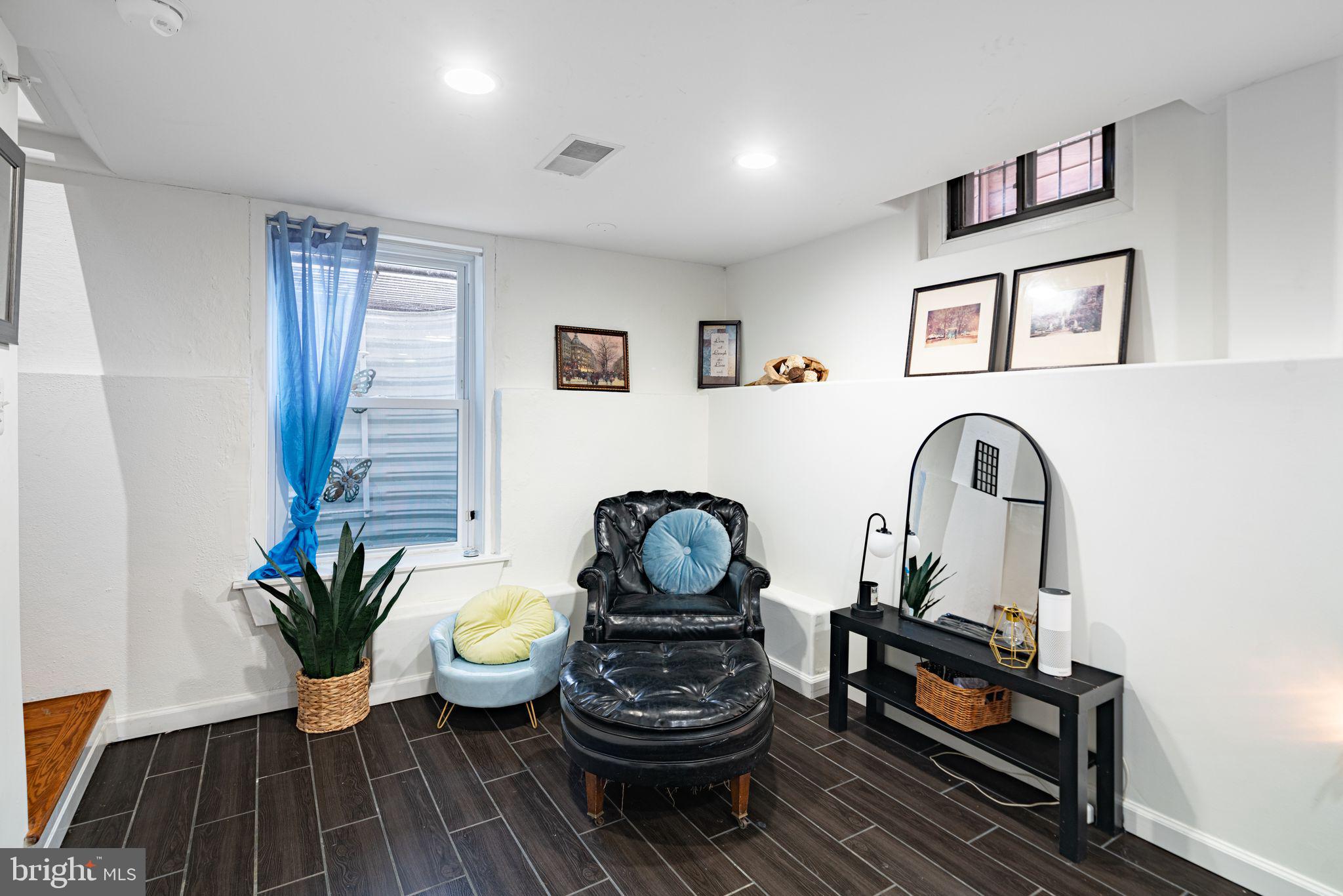 729 South 12th Street, Unit 101 Philadelphia, PA 19147 - Photo 8 of 25 a living room with furniture and a potted plant