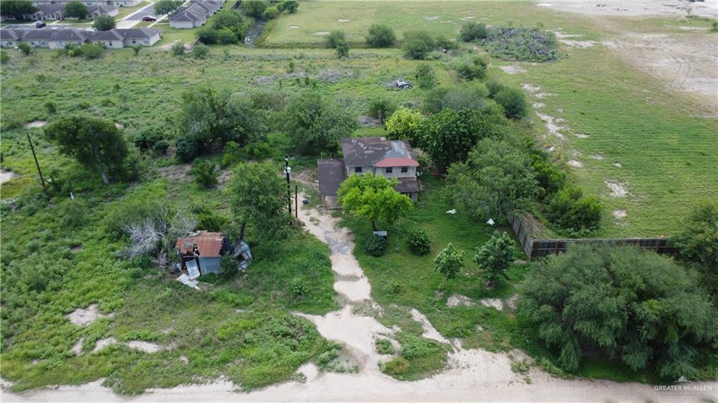 1524 West Hi Line Road Pharr, TX 78577 - Photo 16 of 34 an aerial view of residential house with outdoor space and trees all around