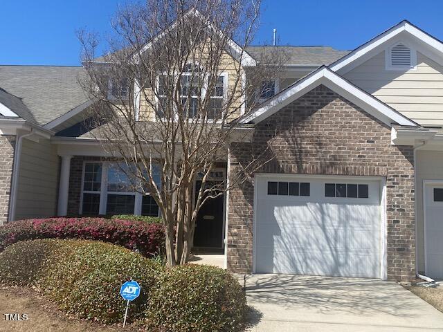 10103 Falls Meadow Court Raleigh, NC 27617 - Photo 1 of 54 a front view of a house with a tree