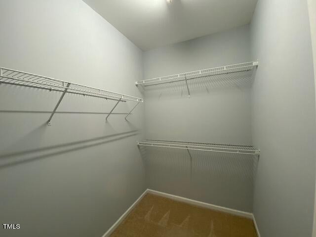 10103 Falls Meadow Court Raleigh, NC 27617 - Photo 14 of 54 a view of a room with racks on the wall