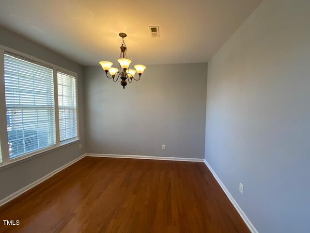 10103 Falls Meadow Court Raleigh, NC 27617 - Photo 21 of 54 wooden floor in an empty room with a window