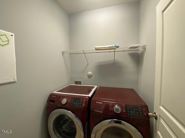 10103 Falls Meadow Court Raleigh, NC 27617 - Photo 24 of 54 a utility room with dryer and washer