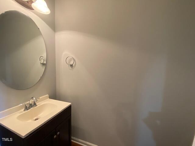 10103 Falls Meadow Court Raleigh, NC 27617 - Photo 26 of 54 a bathroom with a sink mirror and vanity