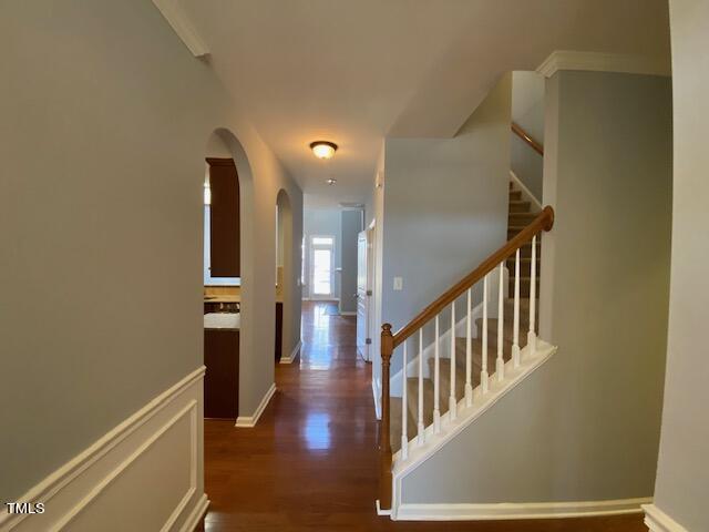 10103 Falls Meadow Court Raleigh, NC 27617 - Photo 27 of 54 a view of hallway with stairs and wooden floor