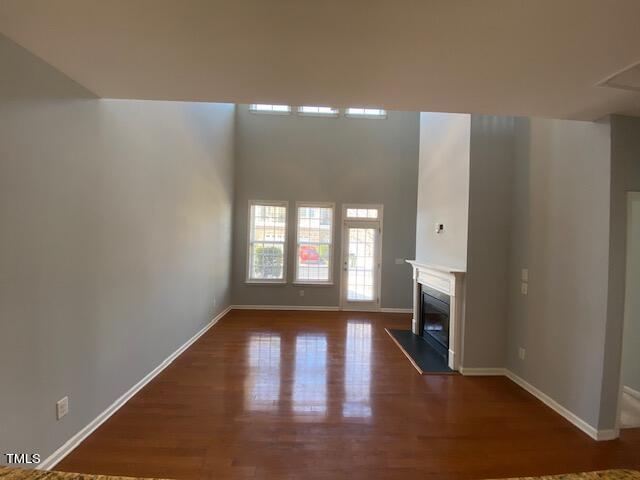10103 Falls Meadow Court Raleigh, NC 27617 - Photo 3 of 54 a view of empty room with wooden floor and fan