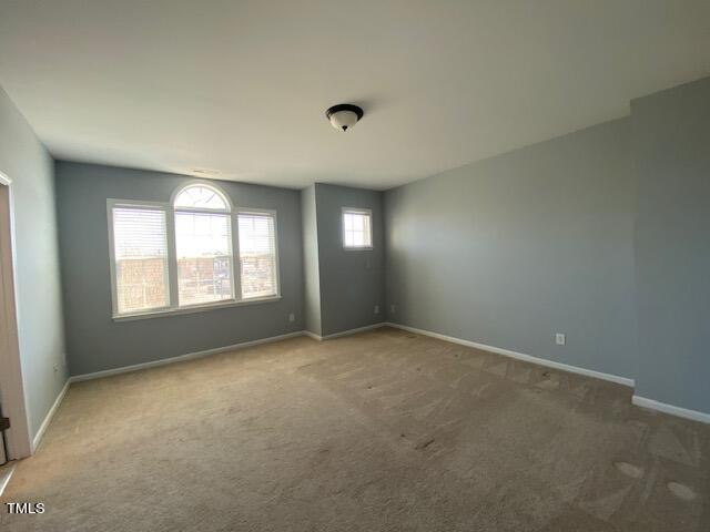 10103 Falls Meadow Court Raleigh, NC 27617 - Photo 35 of 54 an empty room with windows