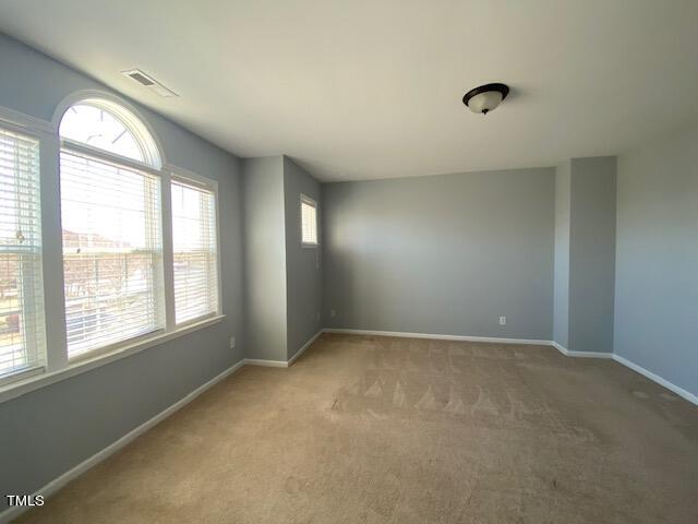 10103 Falls Meadow Court Raleigh, NC 27617 - Photo 36 of 54 an empty room with a window