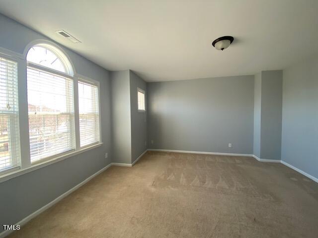 10103 Falls Meadow Court Raleigh, NC 27617 - Photo 37 of 54 an empty room with a window