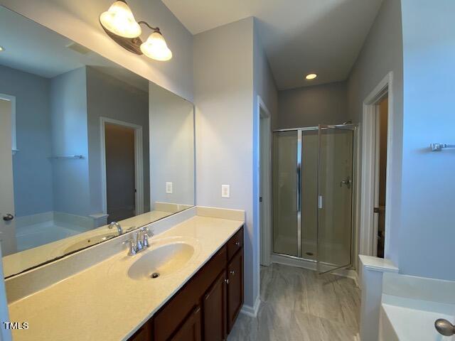 10103 Falls Meadow Court Raleigh, NC 27617 - Photo 38 of 54 a bathroom with a double vanity sink mirror and double