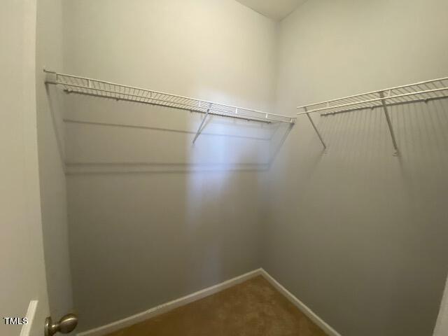 10103 Falls Meadow Court Raleigh, NC 27617 - Photo 39 of 54 a view of a room with racks on the wall