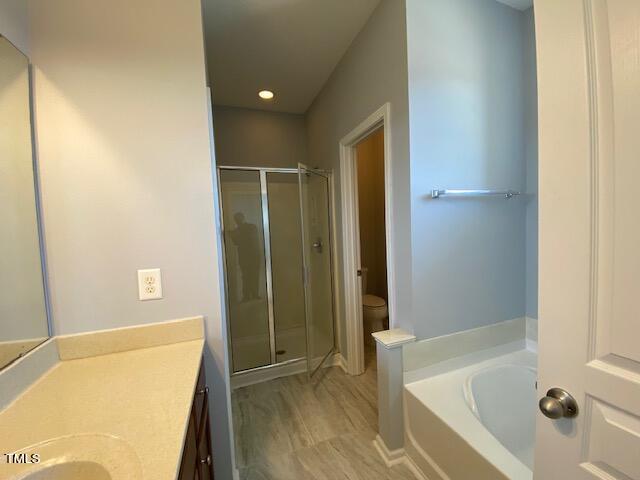 10103 Falls Meadow Court Raleigh, NC 27617 - Photo 41 of 54 a bathroom with a tub and shower