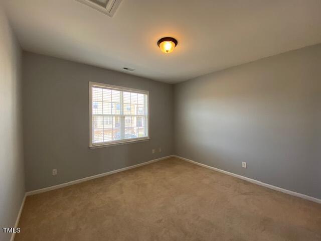 10103 Falls Meadow Court Raleigh, NC 27617 - Photo 43 of 54 an empty room with a window