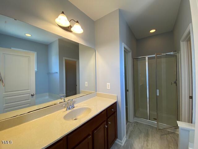 10103 Falls Meadow Court Raleigh, NC 27617 - Photo 45 of 54 a bathroom with a double vanity sink and a mirror