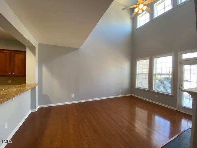 10103 Falls Meadow Court Raleigh, NC 27617 - Photo 7 of 54 an empty room with wooden floor and windows