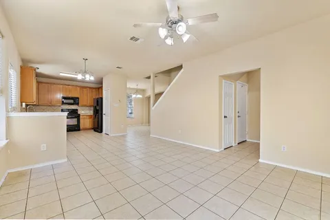 a view of a kitchen with a sink and a refrigerator