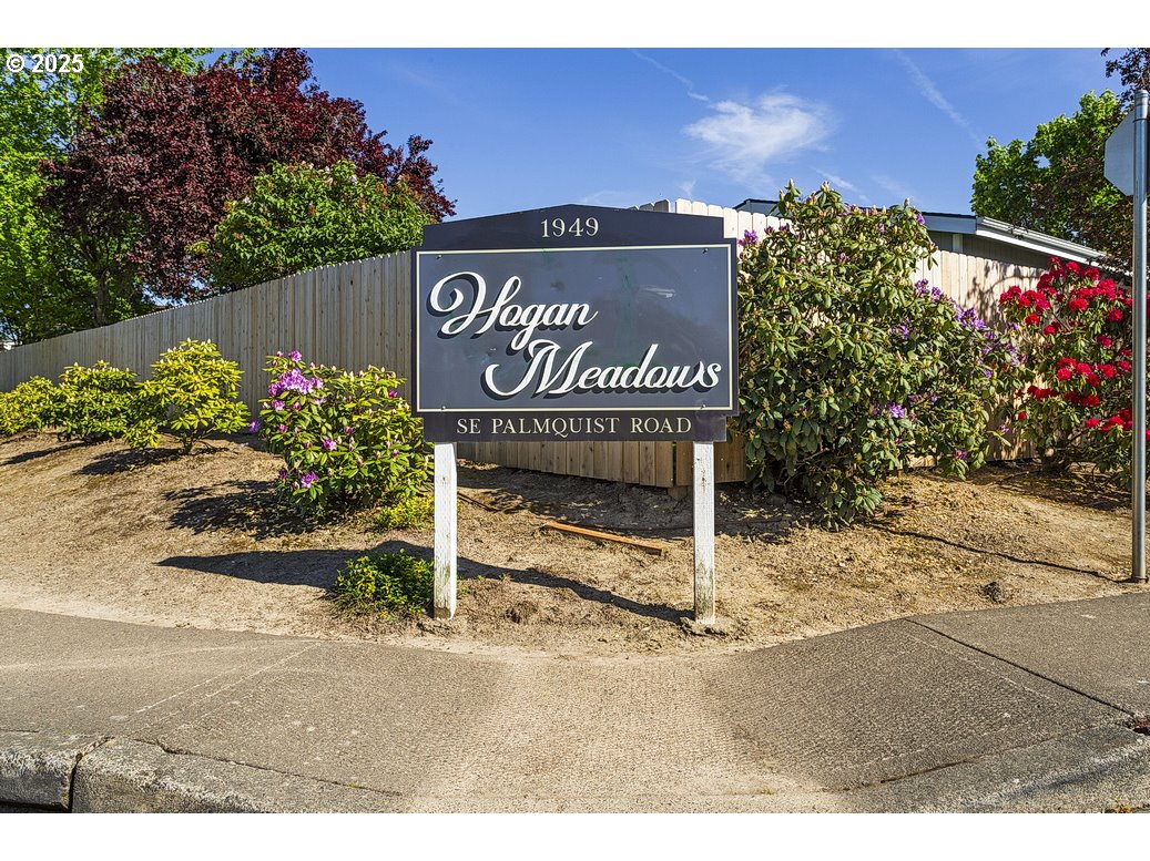 1949 Southeast Palmquist Road, Unit 100 Gresham, OR 97080 - Photo 2 of 28 a view of outdoor space with sign board
