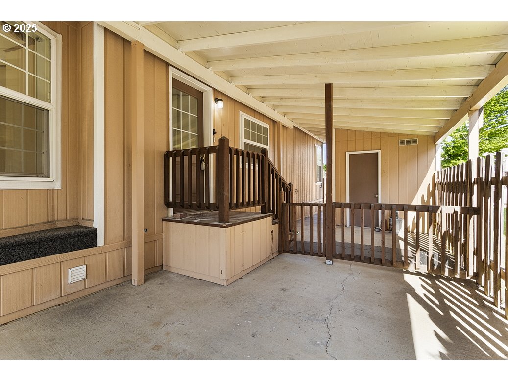 1949 Southeast Palmquist Road, Unit 100 Gresham, OR 97080 - Photo 6 of 28 a view of front door and deck