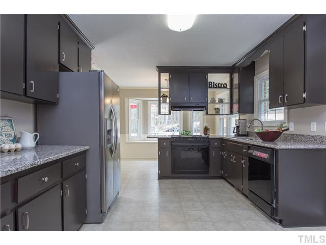 7929 Secluded Acres Road Apex, NC 27523 - Photo 3 of 16 Updated Kitchen with GRANITE counters, plenty of cabinet and counter space, bright & open to breakfast room. Kitchen