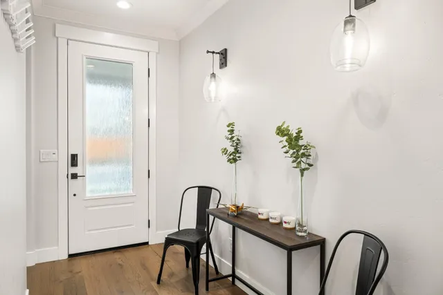 a kitchen with kitchen island granite countertop wooden floors and stainless steel appliances