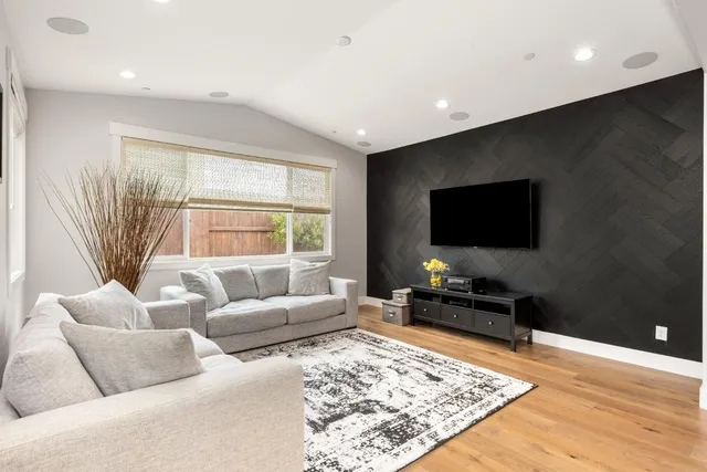 a view of an house with backyard space and garden