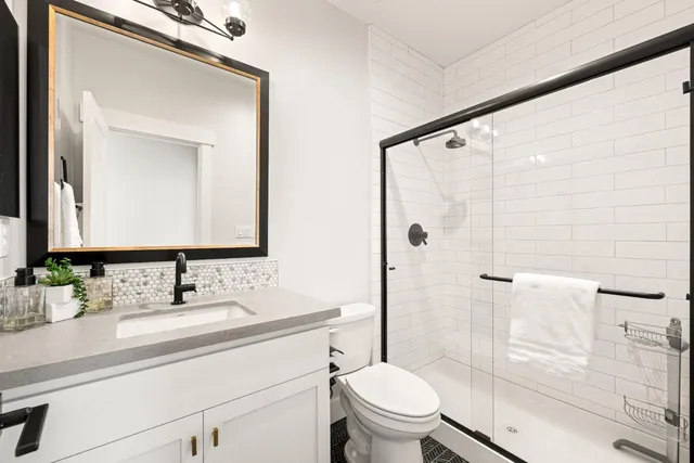 a bathroom with a double vanity sink mirror and double