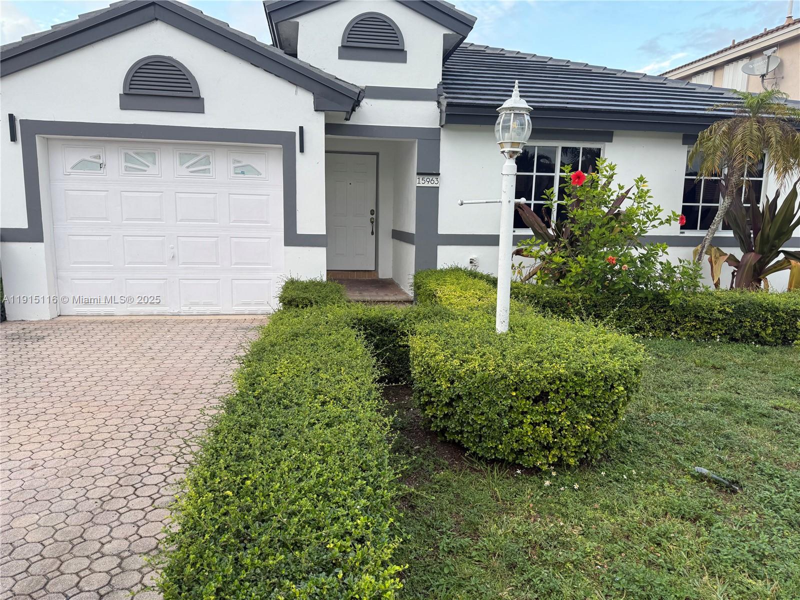 front view of a house with a yard
