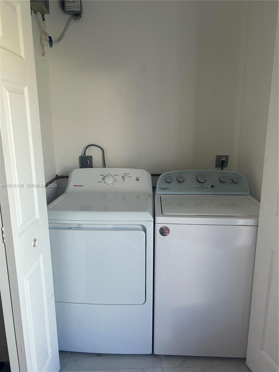 15963 Southwest 82nd Street Miami, FL 33193 - Photo 13 of 15 a utility room with dryer and washer