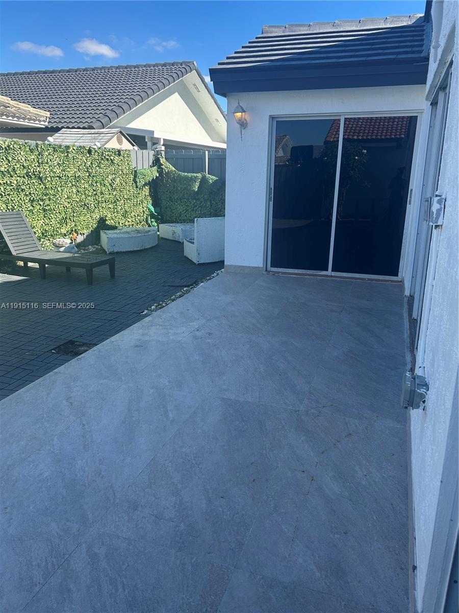 15963 Southwest 82nd Street Miami, FL 33193 - Photo 15 of 15 a view of backyard with seating space