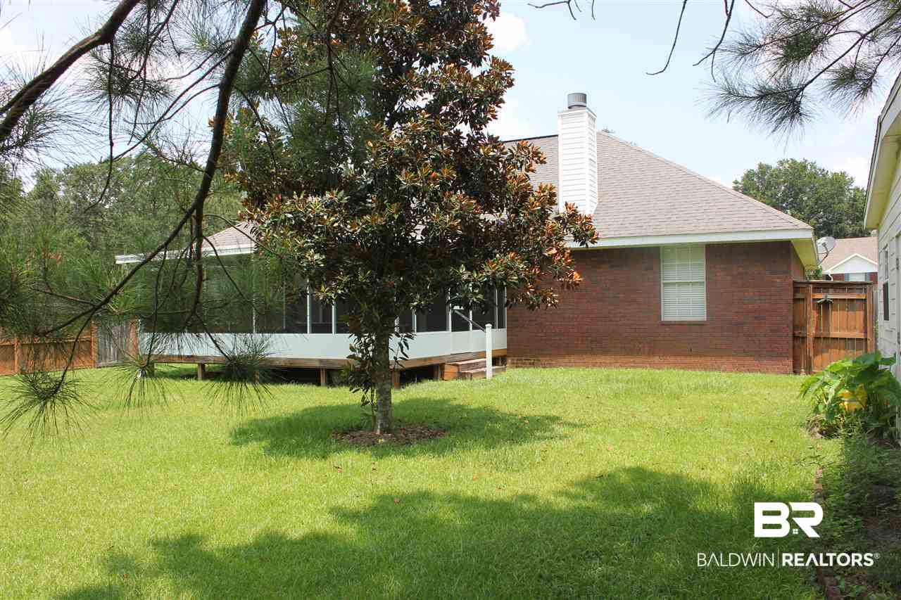 25407 Raynagua Boulevard Loxley, AL 36551 - Photo 11 of 20 View of back of home with screen porch.