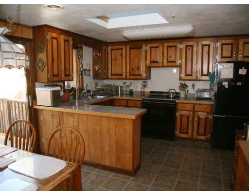 68 Highland Road Boxford, MA 01921 - Photo 8 of 17 a kitchen with stainless steel appliances granite countertop a sink a stove counter space and a window
