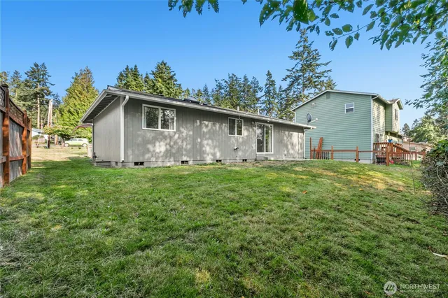 a view of a house with yard and a garden