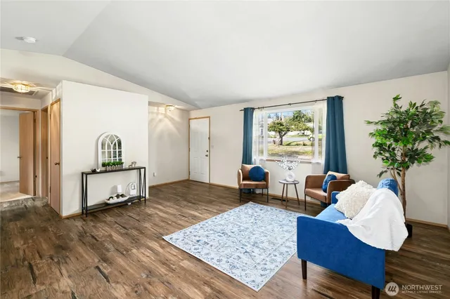a living room with furniture rug and window