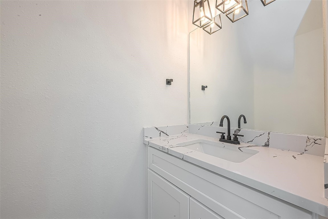 4135 Mallow Street, Unit B Houston, TX 77051 - Photo 9 of 11 a bathroom with a sink and vanity