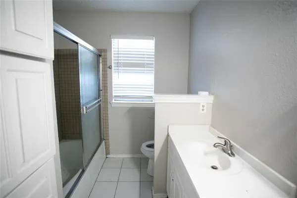 a bathroom with a bathtub sink and toilet
