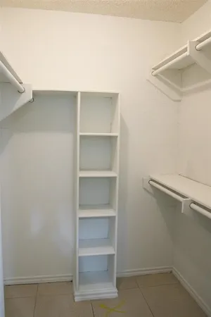a view of an empty walk in closet